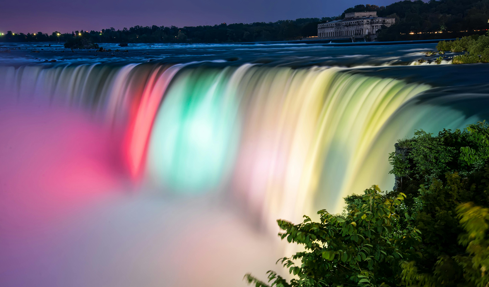 The Canadian Horseshoe Falls illuminated in rainbow colours